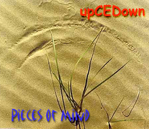 Album cover , sand with writing upCEDown Pieces of mind