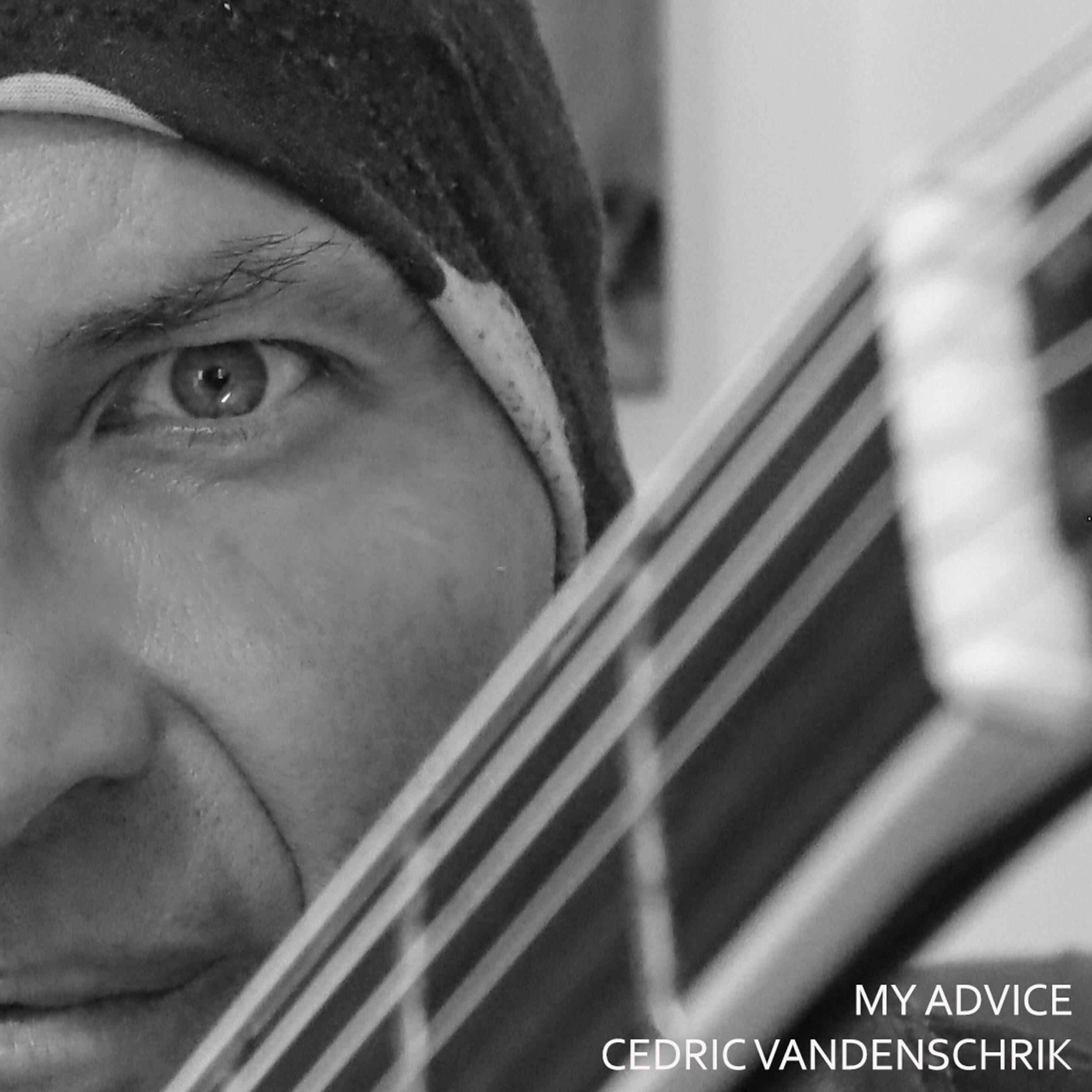 Photo of Cedric Vandenschrik with guitar in front and writing on bottom right: My Advice Cedric Vandenschrik