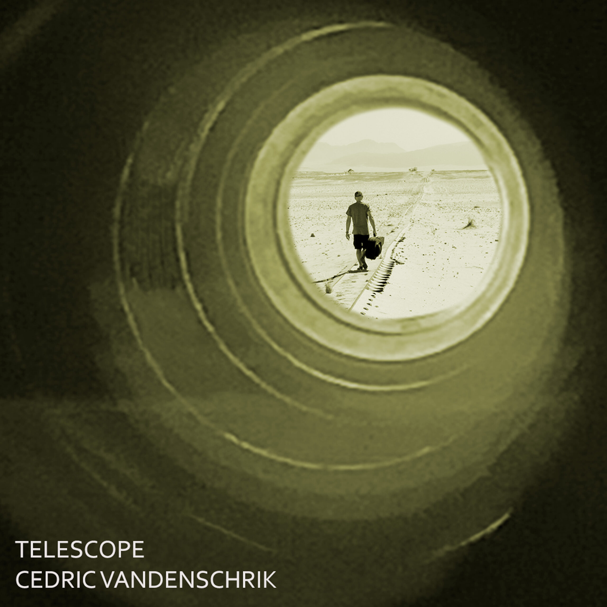 image of man walking along track line as seen through a telescope with writing in bottom left: TELESCOPE CEDRIC VANDENCHRIK